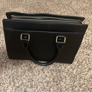 Black with gold hardware Small/Medium sized bag.